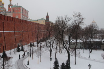Moscow, Russia"; January 2017: Few tourists Visiting the Kremlin with snow in winter