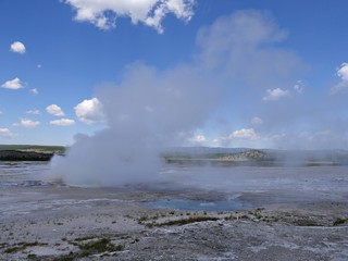 Breathtaking view of steam rising from the Clepsydra Geyser at the Lower Geyser Basin, Yellowstone National Park.