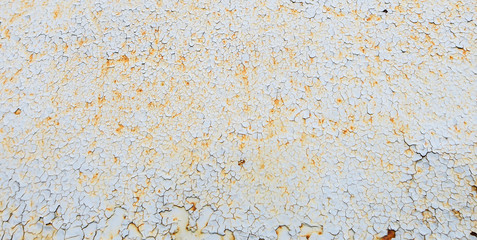 Rust, peeling paint. Cracked paint on the metal. The background on the topic of rust. Corrosion. The texture is seamless. cracks in the paint