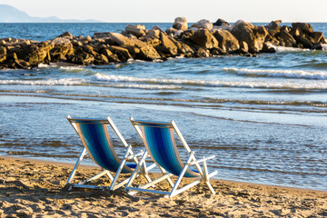 Two beach chairs on the beach on the Tyrrhenian Sea