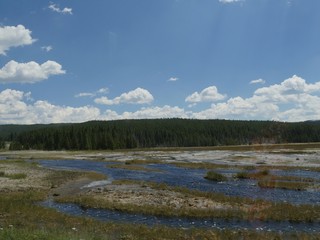 Breathtaking view of boiling water overflowing from around the Great Fountain Geyser at Firehole Lake Drive, Yellowstone National Park, Wyoming.