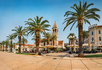 Fototapeta na wymiar Sunny summer cityscape of Trogir. Empty moning street view of old Adriatic town. Beautiful world of Mediterranean countries. Traveling concept background.