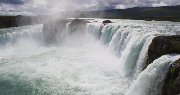 Iceland nature landscape Godafoss waterfal. Famous tourist attraction and landmarks destination in Icelandic nature landscape on the ring road in summer. RED Cinema Camera SLOW MOTION.