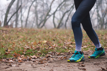 Sportive woman run in park from back