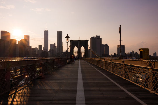 Fototapeta A bridge and city at sunset