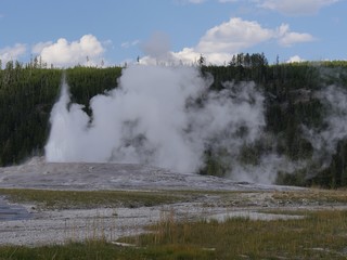 Steam and water pressure show at the Old Faithful geyser at Yellowstone National Park, Wyoming.
