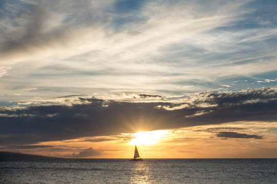 A sailboat at sunset