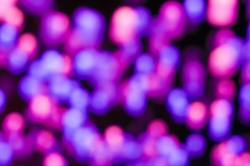 blurred background colorful lights bokeh effect. Festive illuminations, the lights of the city....