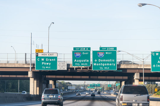 Atlanta, USA - April 21, 2018: Road exit sign on interstate highway 85 to Atlanta internation airport, domestic flights with cars driving in Georgia city