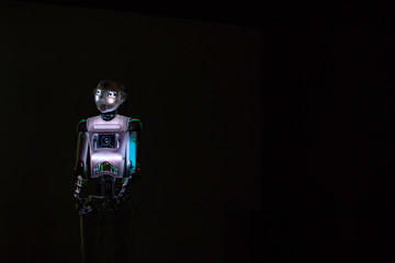 Robot man in the dark. Future concept