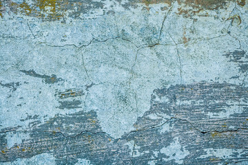 Wall fragment with attritions and cracks. Old paint peeling from wall texture background. Grunge wall white gray background texture.