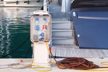 Electrical outlets for charging on boats in sea coast in Mediterranean. Charging station for boats...