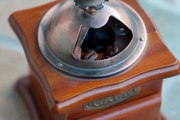 Close-up of a coffee grinder made of wood
