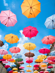 Fototapeta na wymiar Colorful umbrellas. Colorful umbrellas in the sky. Street decoration.