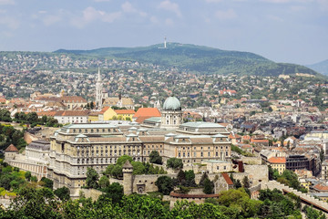 Vacation, travel, Europe. View on Budapest from Gellert Hill, Hungary. Ancient houses and cathedrals in background of mountains.
