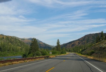Beautiful drive along North Fork Highway with the North Fork Soshone River flowing, on the road to the east entrance of Yellowstone National Park.