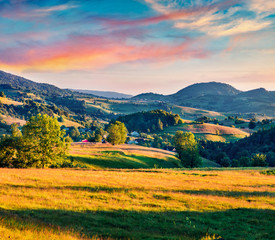 Superb morning scene of Rogojel village. Spectacular summer sunrise in Cluj County, Romania, Europe. Beauty of countryside concept background.