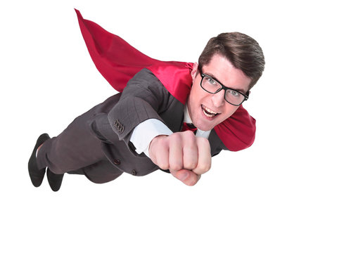 confident superhero businessman is flying to you