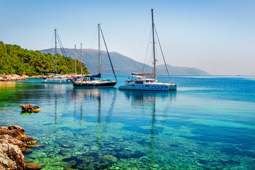 Obraz premium Attractive morning view of Fiskardo port. Amazing summer seascape of Ionian Sea. Colorful scene of Kefalonia island, Greece, Europe. Traveling concept background.
