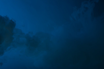 Fototapeta na wymiar Cloud of vapor. Dark blue background