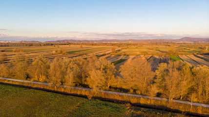 Aerial view of autumn fields at sunset.