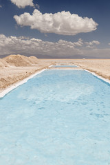 Water pool of a saline with salt mounds in Salinas Grandes, Jujuy, Argentina