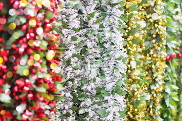 Christmas background,various garlands hanging on the display, selective focus
