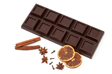 dark chocolate, dried orange, anise, cinnamon, cloves - composition. isolated on white background