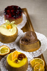 berry cake, lemon cake, cheesecake, desserts on a tray