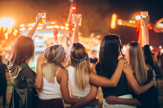 Back View Of Group Of Girls Having Fun At The Music Festival