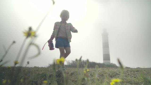 Lighthouse in the Mist | Cute child making a picture