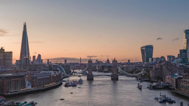 Aerial Drone Hyperlapse Helicopter View Of Tower Bridge London City Skyline The Shard Sky Garden And Thames River Time Lapse At Sunset