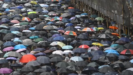 Hongkong, China - August 2019: background top view 2019 asia business people crowd. concept american propaganda woman and asian man protest with umbrella. voice political rally about gdpr resistance