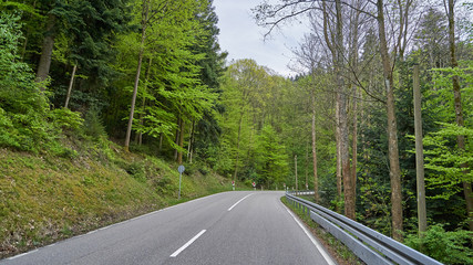 Beautiful asphalt road with turns through the Schwarzwald forest in Germany