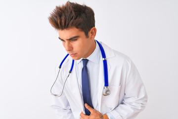 Fototapeta premium Young handsome doctor man wearing stethoscope over isolated white background with hand on stomach because nausea, painful disease feeling unwell. Ache concept.