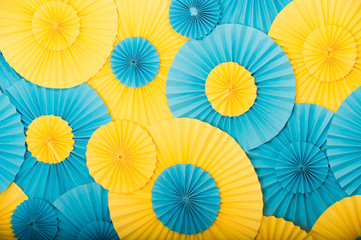 Round decor texture. Party shop concept. Round blue and yellow decorative details. Decorate. Buy decorations. Ukrainian colors. Festive decor. Birthday and holidays decor