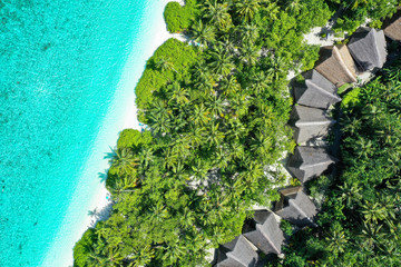 Aerial top down view with drone of an tropical exotic island paradise with turquoise crystal clear water and pure white sand beach