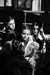 Three girls in school uniform. Back to school. Education. Happy teenage girls having fun. Best friends.