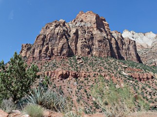 Cropped view of high steep sharp cliffs and gorgeous clouds at Zion National Park, Utah, USA.
