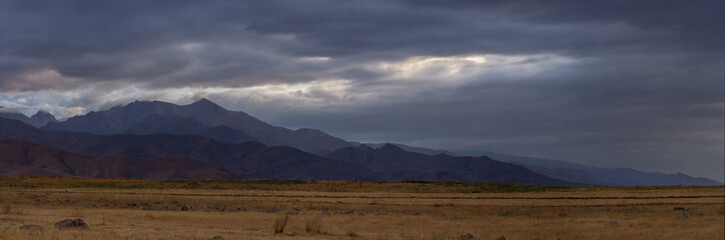 foothills at sunset, mountain ranges of Kyrgyzstan