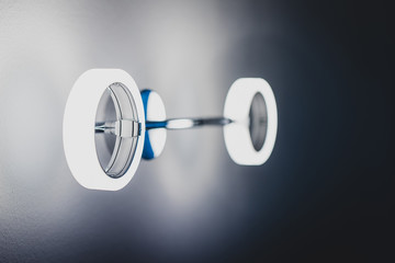 Modern round metal wall light. Beautiful wall mounted light in blue colors