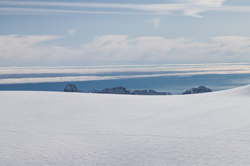 Fototapeta na wymiar Mountains in winter beyond the horizon