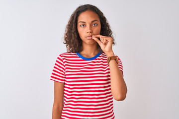 Young brazilian woman wearing red striped t-shirt standing over isolated white background mouth and...