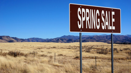 Spring sale word on road sign