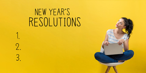 New years resolution with young woman using a laptop computer