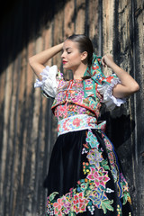 Beautiful woman wearing traditional slovak folk costumes. .