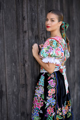 Beautiful woman wearing traditional slovak folk costumes. .