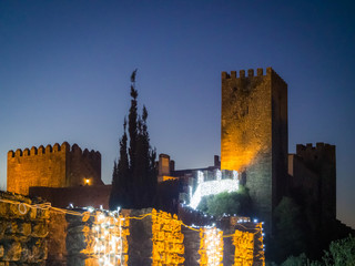 Sunset view of the old town walls, decorated for Christmas, in Obidos, Portugal