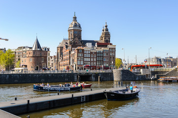 Obraz na płótnie Canvas Sightseeng at Canal Boats near the Central Station of Amsterdam