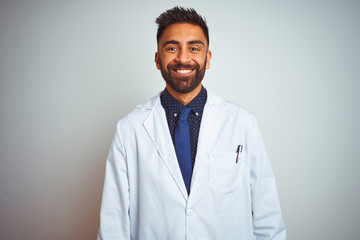 Young indian doctor man standing over isolated white background with a happy and cool smile on face. Lucky person. - Powered by Adobe